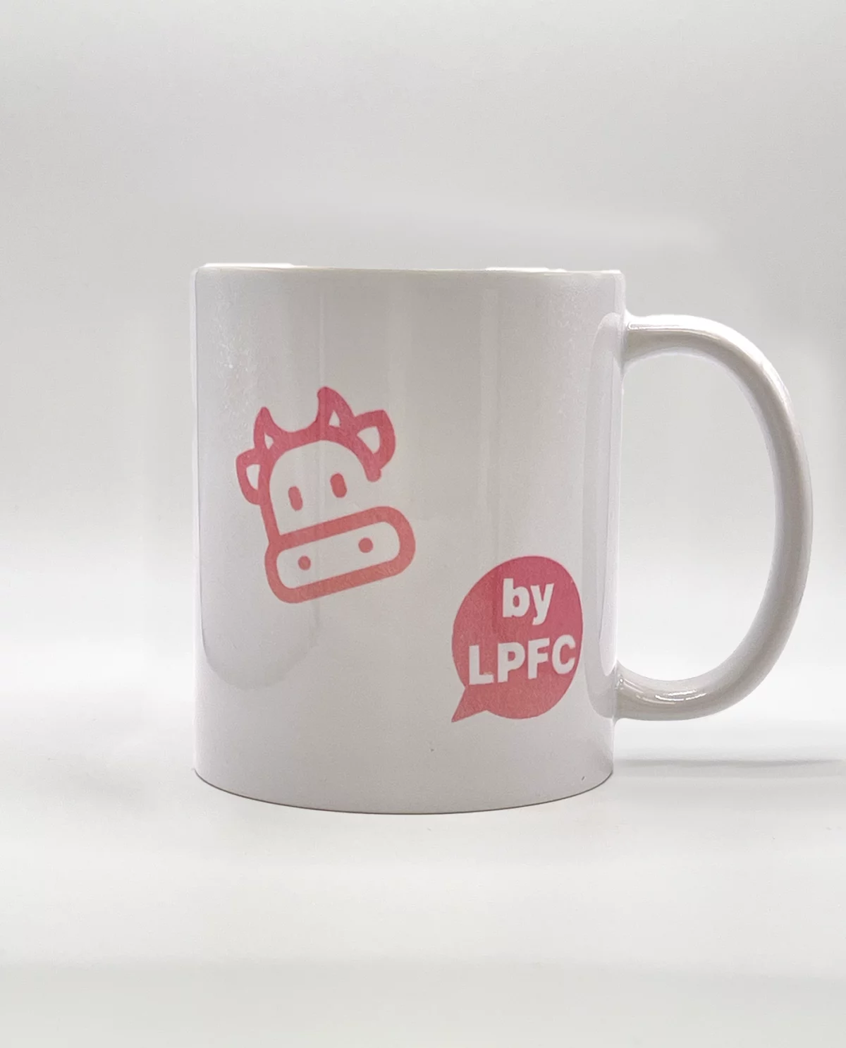Mug rose artisanal fait à la main en Franche-Comté, avec l'expression "T'as meilleur temps" imprimée en rouge et noir, cadeau original.